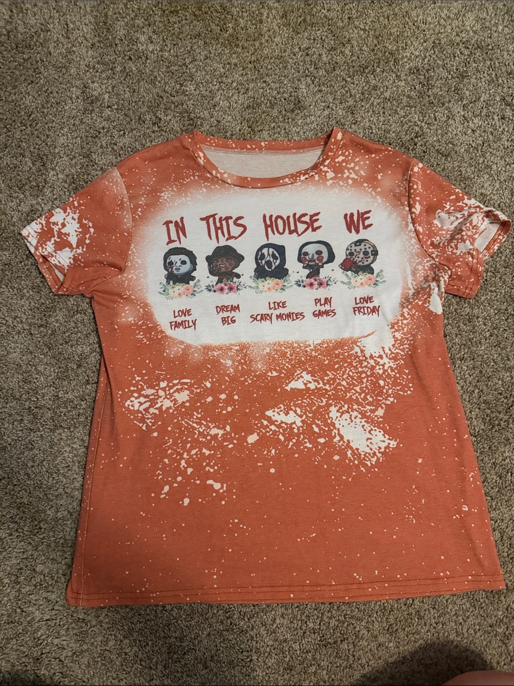 Woman’s Orange Graphic Tee - 'In This House' Halloween